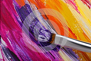 Painting with colorful oil paints on white canvas, closeup view