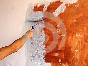 Painting a dark spot on the wall with light paint