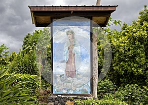 Painting depicting `Our Lady of Hawaii` outside at St. Benedicts Painted Church on the Big Island, Hawaii.
