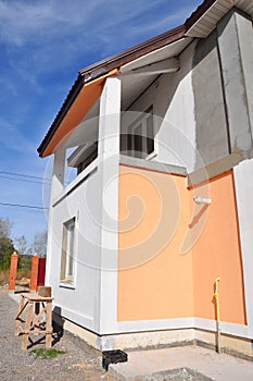 Painting house wall with construction foundation all waterproofing, damp proofing, insulation with contrete path to avoid water