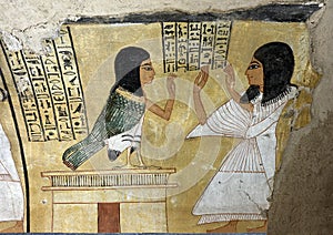 Painting of Inherkhau paying homage to his own finely drawn Ba-bird perched on his tomb.