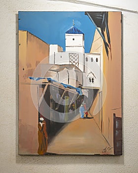 Painting of the medina by an unnamed artist on display inside the Chouara Tannery in Fes, Morocco.