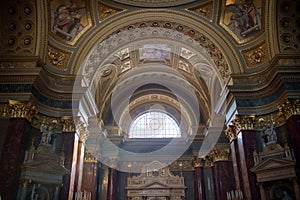 Painting murals and frescoes inside Catholic Cathedral interior in Budapest.