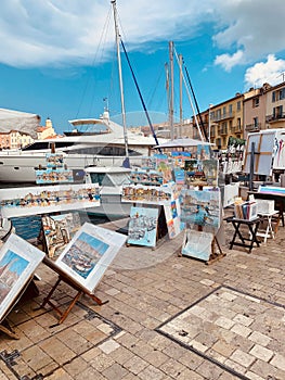 Painting near the yacht in the harbor of Saint Tropez, France