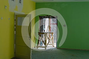 Painting the office space in bright colors. Installation of windows and doors. Renovation in a modern building. Interior