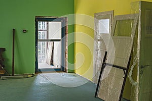 Painting the office space in bright colors. Installation of windows and doors. Renovation in a modern building. Interior