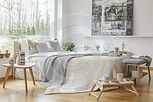 Painting in scandi bedroom interior