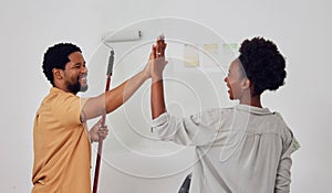 Painting, success or black couple high five in DIY, home renovation or house remodel together with a paintbrush. Happy