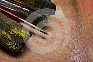 Painting tools colour palette and Artist paint brushes on abstract artistic background