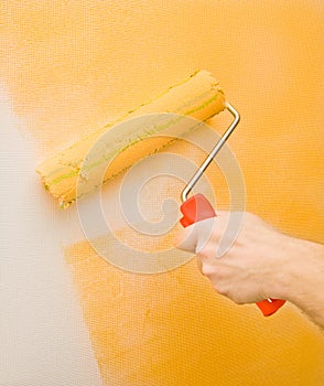 Painting the wall with roller