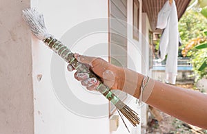 Painting walls.Painter paints using a brush