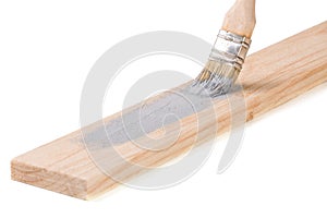 Painting wooden board paint brush gray color isolated on white background