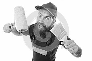 Painting works. Bearded laborer. Repair and renovation. Repair tips. Engineer architect. Man worker with paint roller