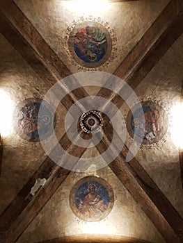 Paintings on ceilings in arcades of Bologna, Italy