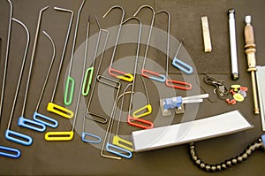 Paintless Dent Repair Kit Tools Set On The Work Table. Tools For Repair Dents On Car Body. Glue tabs With Slide Hammer