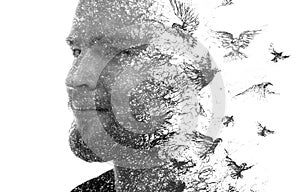 Paintography. A black and white portrait of a man combined with ink painting of flying birds.