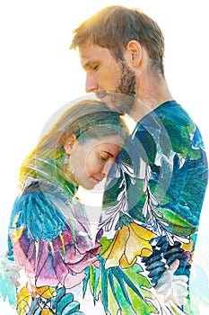 Paintography. Double exposure of a beautiful young couple combined with a hand made painting of bright green leaves and flowers