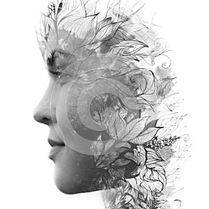 Paintography. Double exposure profile of a young natural beauty, with face and hair combined with hand drawn leaves dissolving