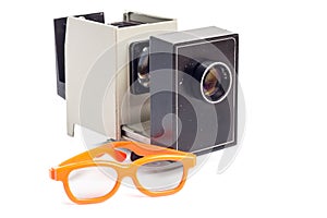 Pair of 3-d cinema glasses and projector isolated on white background