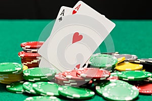 Pair of aces and OOF casino chips