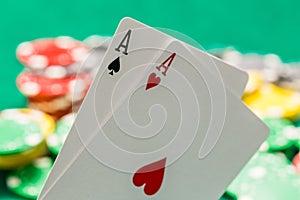 Pair of aces and OOF casino chips