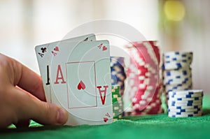 Pair of aces and poker chips, texas hold`em poker