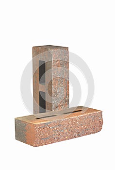 Pair of Aged Red Bricks With Rectangular Wholes for Construction Isolated on White