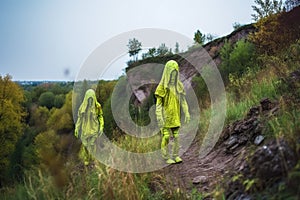 pair of aliens on a hike, exploring the natural landscape and discovering new lifeforms photo