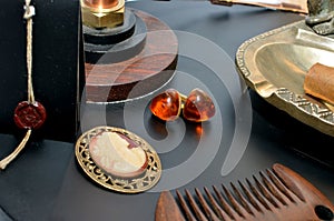 A pair of amber earrings on black background