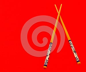 A pair of asian chopsticks.