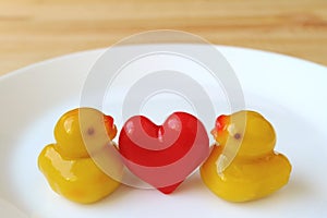 Pair of Baby Duck with Red Heart Marzipans, Thai Traditional Kanom-Look-Choup Sweets Served on White Plate