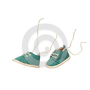 Pair of baby shoes flying in the air simulating walking isolated on white background