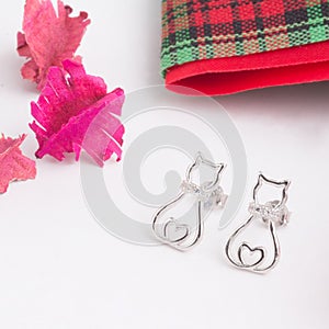 A pair of beautiful 925 sterling silver earrings in cat shape decorated with cubic zirconia