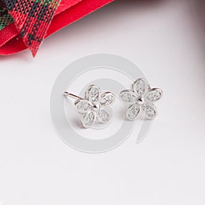 A pair of beautiful 925 sterling silver earrings in flower shape