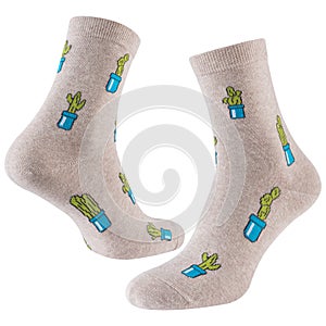 A pair of beige socks with drawings of many cacti in flowerpots, on a white background