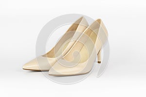 Pair of beige women`s leather shoes on high-heeled  on white background. Concept for female shopping and fashion