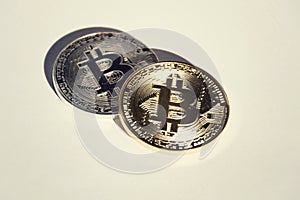 Pair of bitcoin coins isolated on white background, cryptocurrency investing