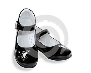 A pair of black baby shoe isolated on white