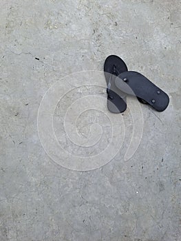 a pair of black flip flop sandal