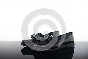 pair black glossy loafer flat woman shoes