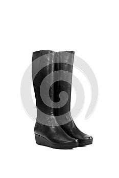 Pair of black leather boots on a white background with copy space