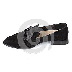 Pair of black leather velvet women's shoes with a sharp nose beige insole and buckle on a low square heel on a white