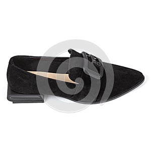 Pair of black leather velvet women's shoes with a sharp nose beige insole and buckle on a low square heel on a white