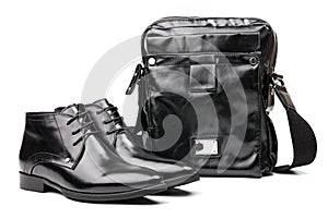Pair of black men boots and messenger bag