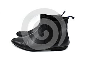 A pair of black mens leather chelsea boots isolated on white background