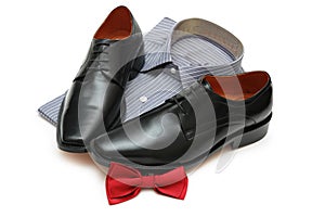 Pair of black shoes, new shirt and bow-tie isolated