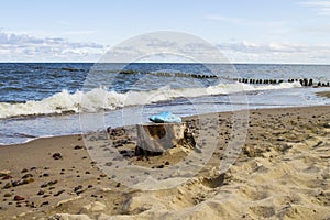 Pair of blue flip flops, sandal on beach. Summer time vacation attribute, slippers, shoes comfortable footwear