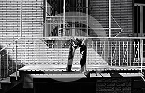 A pair of blue jeans hanging on the clotheshorse with clothespins out of the balcony Pesaro, Italy