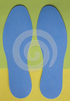 Pair of blue orthotics for shoes. Top view