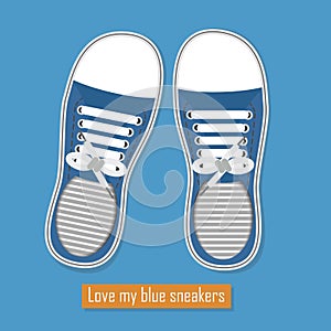 A pair of blue sneakers on blue background